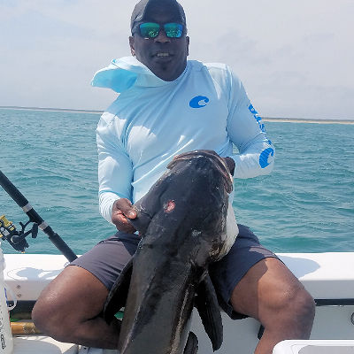 Speck-Tackler angler came to Cape Hatteras just to catch this awesome Cobia.