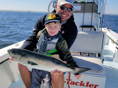 Conner McKenney and his grandfather Tommy hold a nice 10 pound Bluefish together.
