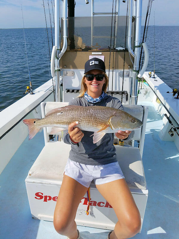 Lily Pierce showing off their nice catch from her Pamlico Sound charter trip.