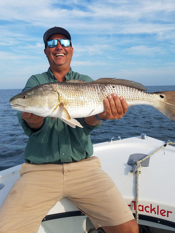 JC holding a nice Red Drum.