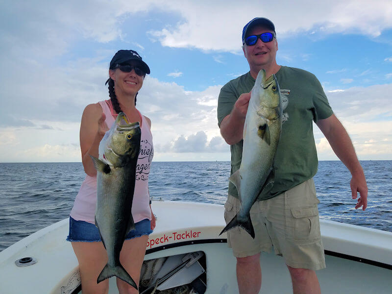 Josh and Amy each holding nice Cape Hatteras Bluefish.